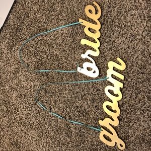 Gold bride and groom sign